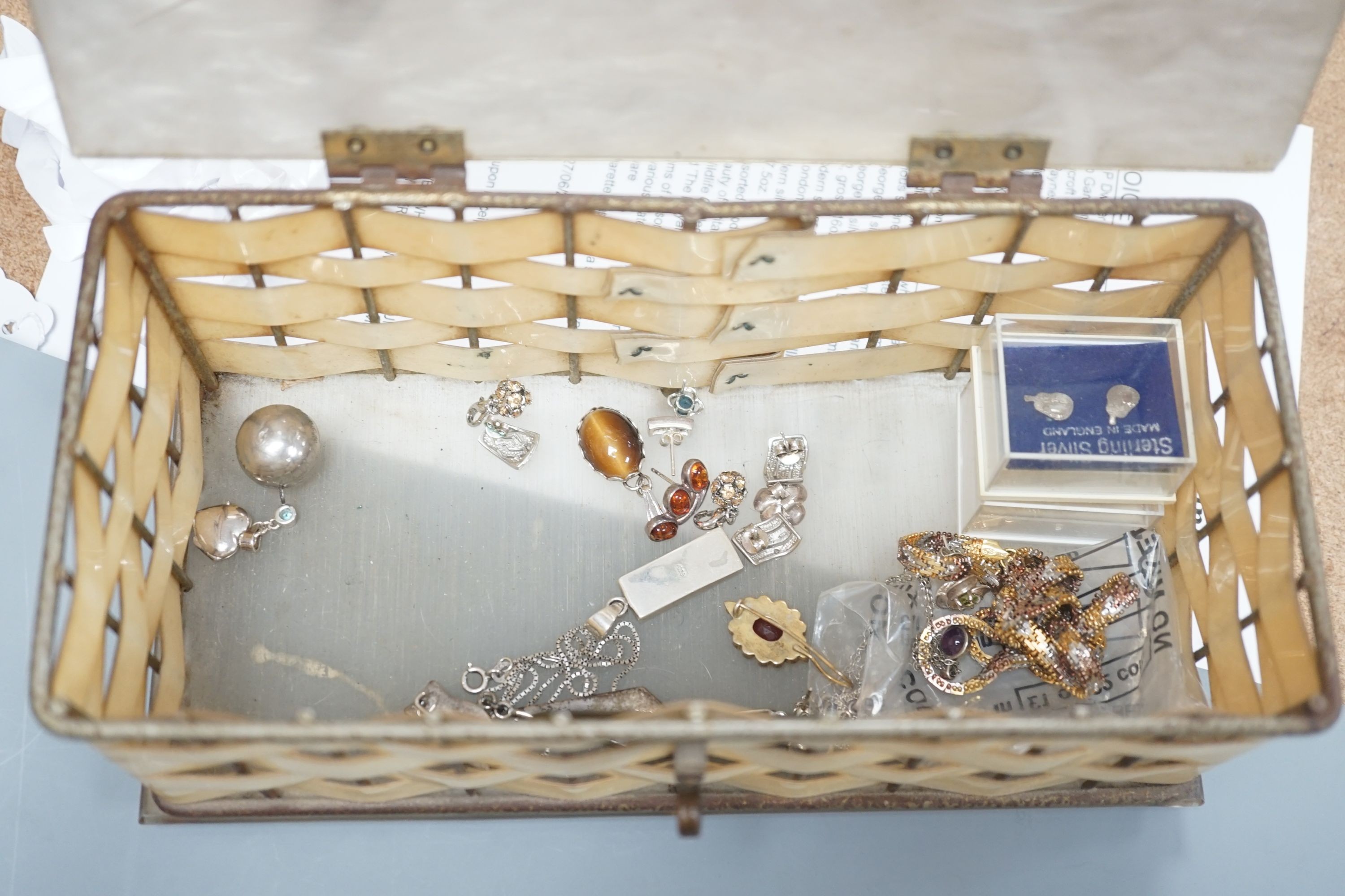 A 1950's box and a quantity of assorted costume jewellery, including continental bangles, etc.